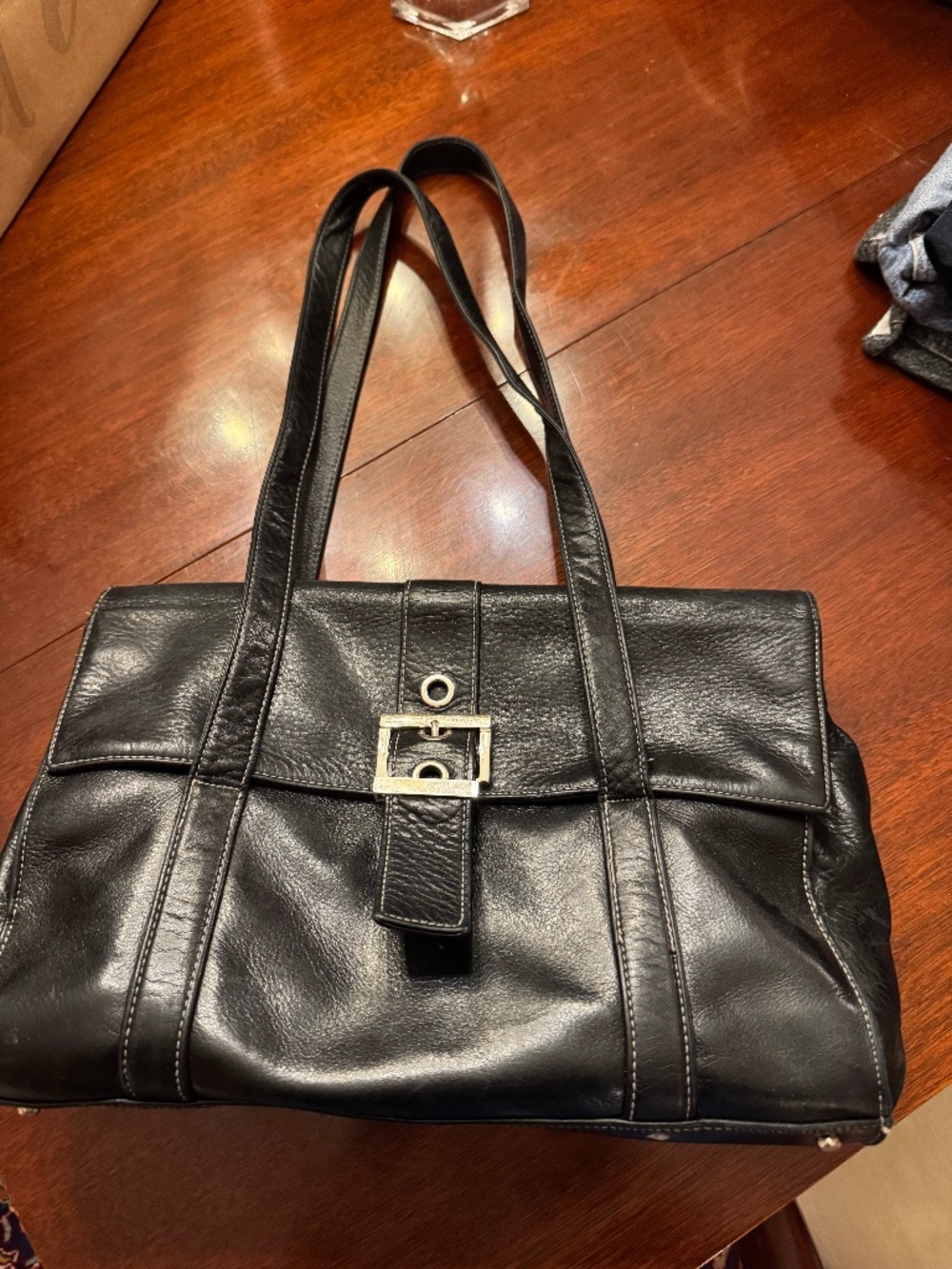 Black leather Perlina handbag.